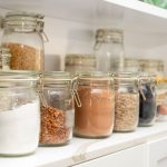 Shelving Solutions - a row of jars filled with different types of food
