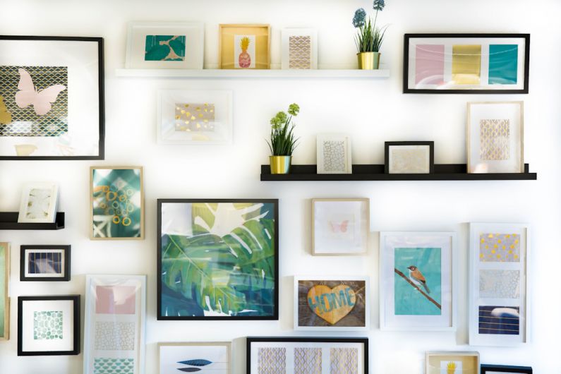 Gallery Wall - assorted-color framed paintings on the wall