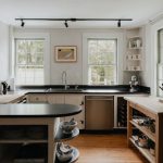Open Shelving - a kitchen with a clock on the wall