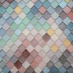 Materials - a multicolored tile wall with a pattern of small squares